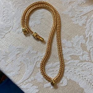 Gold tone chevron emblem necklace. 16”.